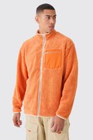 chaqueta oversize de borreguito en contraste naranja