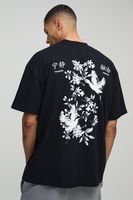 camiseta oversize con cuello extendido y estampado grafico de pajaro y flores negro