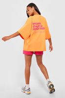 camiseta oversize con eslogan sports athletic naranja