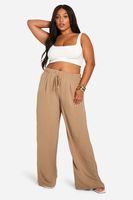 pantalon plus de pernera ancha de tela con cordon elastico beige