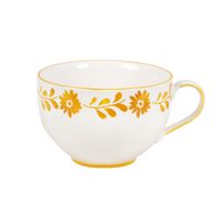 taza de ceramica blanca de flores amarillo