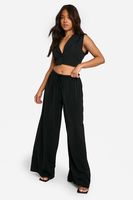 pantalon petite de pernera ancha y tela negro