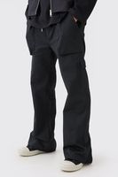 pantalon cargo de campana con cintura elastica y cremallera en el bajo negro