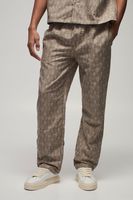 pantalon recto de tela con cintura elastica y estampado geometrico beige