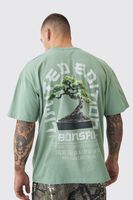 camiseta oversize destenida con estampado de arboles verde